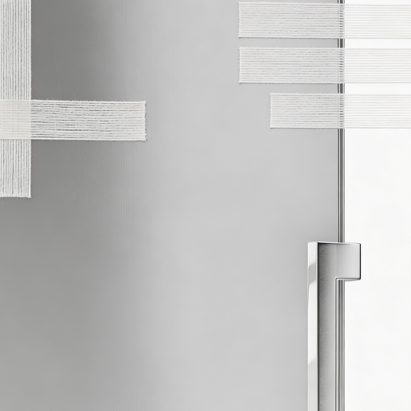 Stainless steel refrigerator with a handle on a white background with filament tape on the hinges.